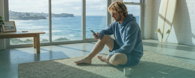 Young man in his new home by the coast. Coastal Finance - Finance Brokers supporting first home buyers in Tasmania and Melbourne Victoria