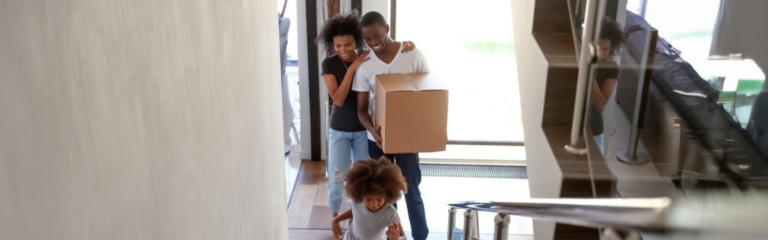 Young family moving into new home, excited. Coastal Finance - Finance Brokers. Contact us for advice.
